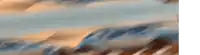 a blurry picture of a sunset over a mountain range