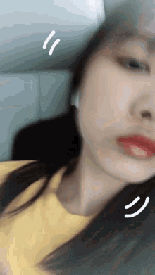 a blurry picture of a woman 's face with a smiley face drawn on it