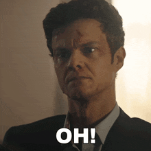 a man in a suit and tie says " oh " in white letters