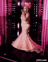 a woman in a long pink dress is standing in front of a mirror with the words t4yce tumblr below her