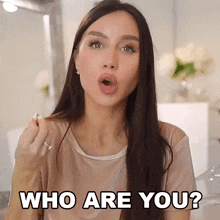 a woman making a funny face and asking " who are you "