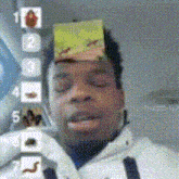 a man with a sticker on his head that says 1 2 3 4 5 6 and 7