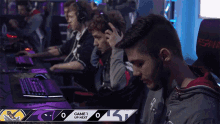 a group of people are playing a video game and the scoreboard says game 1 up next at the bottom