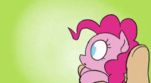 a pink pony is being held by a person with the words boop written on it