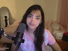 a girl wearing headphones stands in front of a microphone with the words " be in past romantic " on the bottom