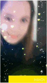 a picture of a girl with hearts on her face and the words inshot on the bottom