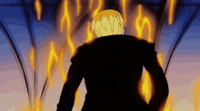 a man in a black suit stands in front of flames