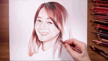 a drawing of a woman 's face with colored pencils in the background