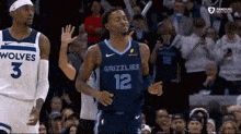 a basketball player with the number 12 on his jersey is dancing