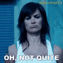 a woman making a funny face with the words oh not quite behind her