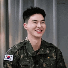 a young man in a military uniform is smiling with the name jungmyeon on the bottom right
