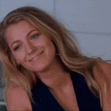 a close up of a woman 's face with a smile on her face