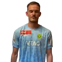 a man is wearing a blue shirt with the word vtag on it