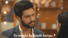a man with a beard is talking to a woman and the words tu mereko barbaadh kanega are above him