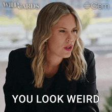 a woman says " you look weird " in front of a wildcards logo