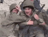 a group of soldiers are fighting each other in a battle .