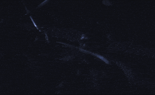 a blurry picture of a person 's face in a dark room