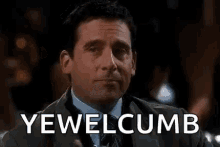 a man in a suit and tie is holding a glass of iced tea and saying yewel cumb .