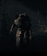 a scarecrow with his arms outstretched is standing in the dark