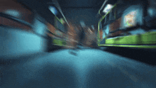 a blurry picture of a bus going down a road at night