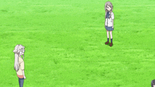 a group of girls are playing in a field with one girl laying on her back