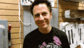 a man wearing a t-shirt that says ' a ' on it