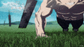 a man is doing push ups in the grass while holding a large sword .