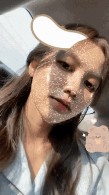 a woman with a mask on her face is sitting in the back seat of a car
