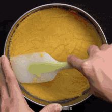 a person is using a spatula in a pan that says icebakes
