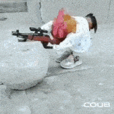 a rooster is holding a gun next to a snowball on the sidewalk .