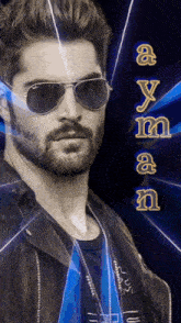 a man with a beard wearing ray-ban sunglasses and a black leather jacket