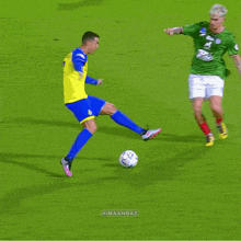 two soccer players running on a field with the number 31 on their jersey