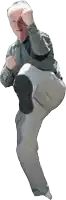 a man in a gray shirt is kicking his leg