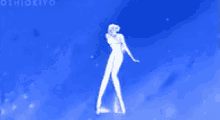 a woman in a long white dress is standing in the middle of a blue sky .