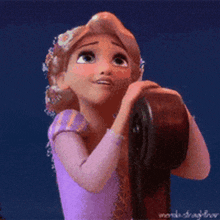 rapunzel from tangled is holding something in her hands and smiling