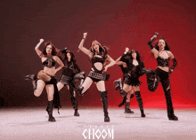 a group of girls are dancing in front of a studio choom logo
