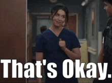 a woman in scrubs is standing next to a man and the words that 's okay