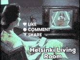 a woman is sitting in front of a television with the words helsinki living room written below her