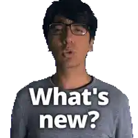 a man wearing glasses says what 's new on his shirt