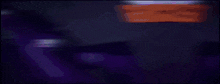 a person 's hand is reaching out towards a purple object