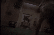 a woman in a white robe is dancing in a room