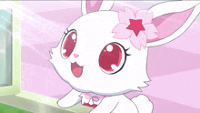 a white rabbit with a pink flower in its ears