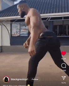 a man without a shirt is dancing in front of a building with a follow button below him