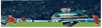 a soccer player in a green and white jersey with the number 9 on it