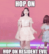 a woman in a white dress is dancing on a pink background with a caption that says `` hop on resident evil '' .