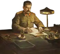 a man in a military uniform sits at a desk writing on a piece of paper