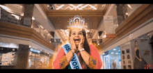 a woman is wearing a sash that says miss nor