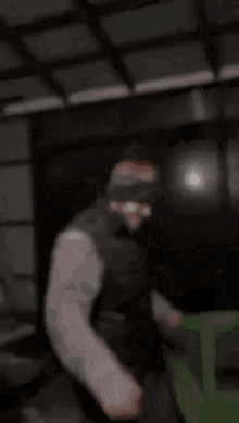 a blurry picture of a man wearing a blindfold