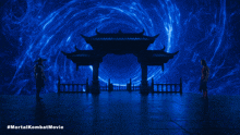 a poster for the mortal kombat movie shows two men standing in front of a blue portal