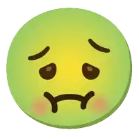 a green smiley face with a sad look on it